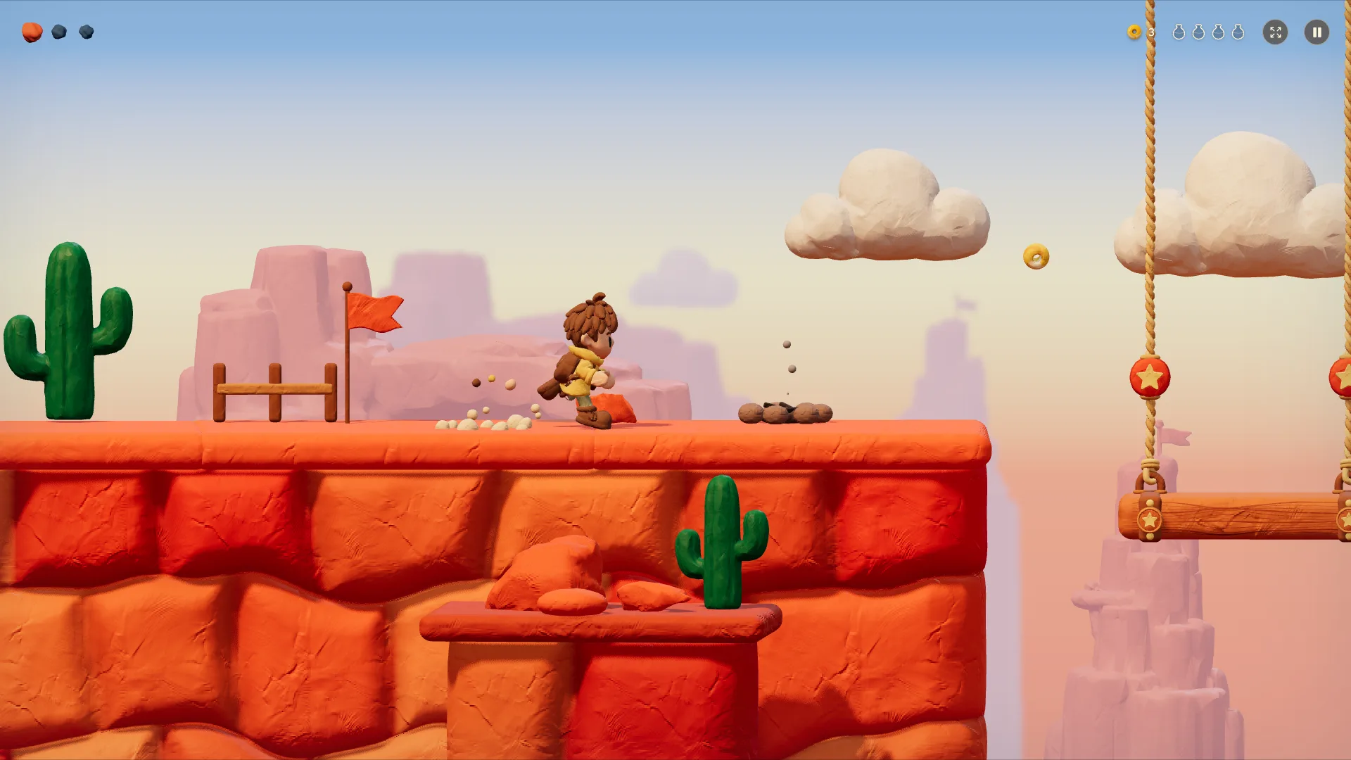 The hero crosses a canyon of orange clay bricks and cacti under a rope swing